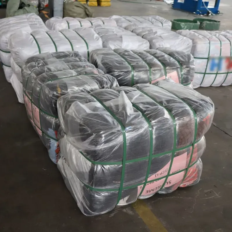 Compressed clothing bales stacked at the warehouse ready for dispatch