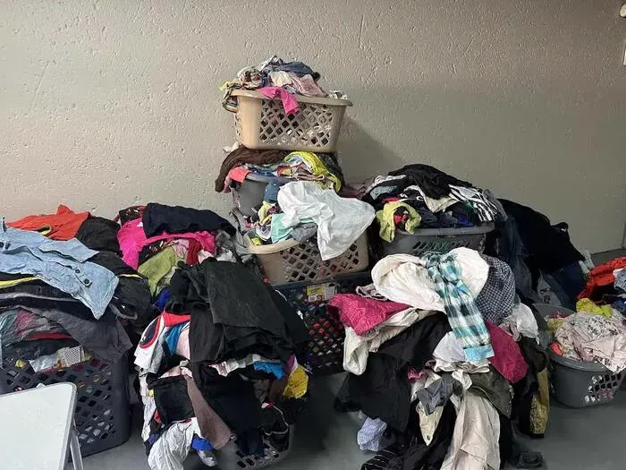Colourful assorted clothing displayed in baskets